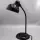 Kaiser Idell 6556 Tischleuchte in Schwarz mit Original-Prägung. Restaurierter Bauhaus-Klassiker von Christian Dell mit authentischem Vintage-Charakter.